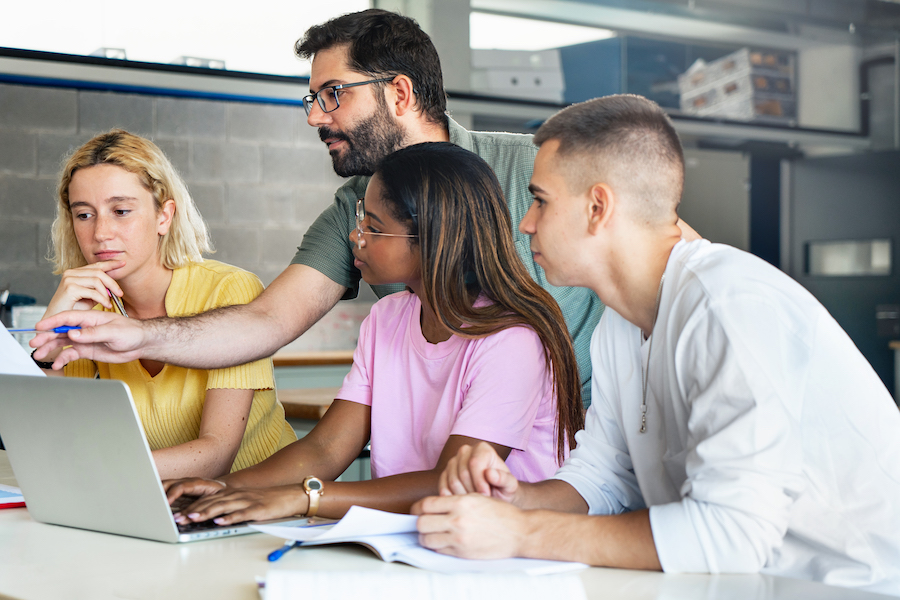 Young teacher with students