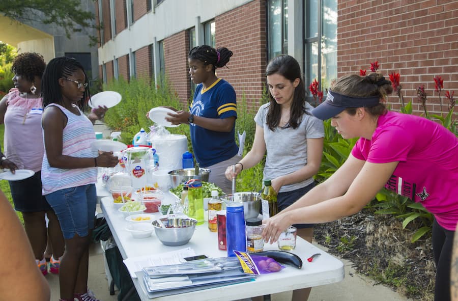 Students working at a food table