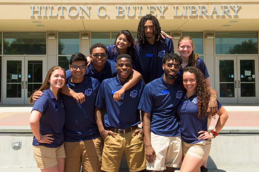 Nine students in front of Buley Library