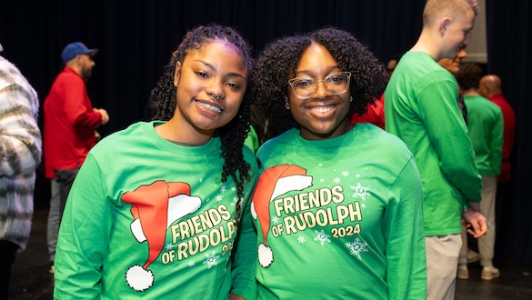 Two women wearing Friends of Rudolph shirt