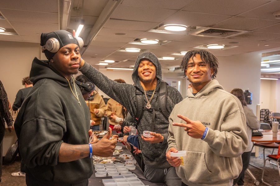 Three students at a soap making event