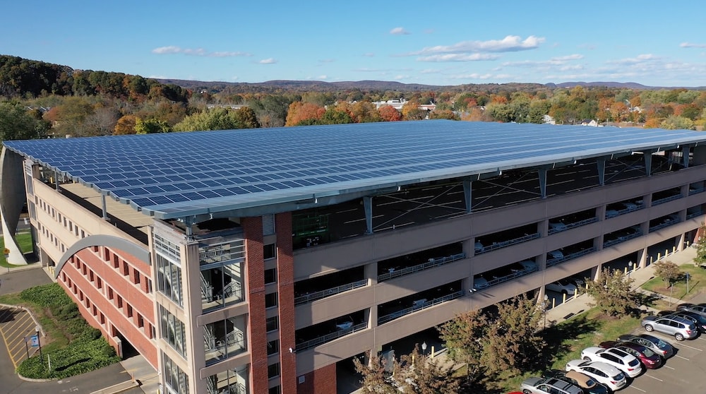A parking garage with solar panels at the top