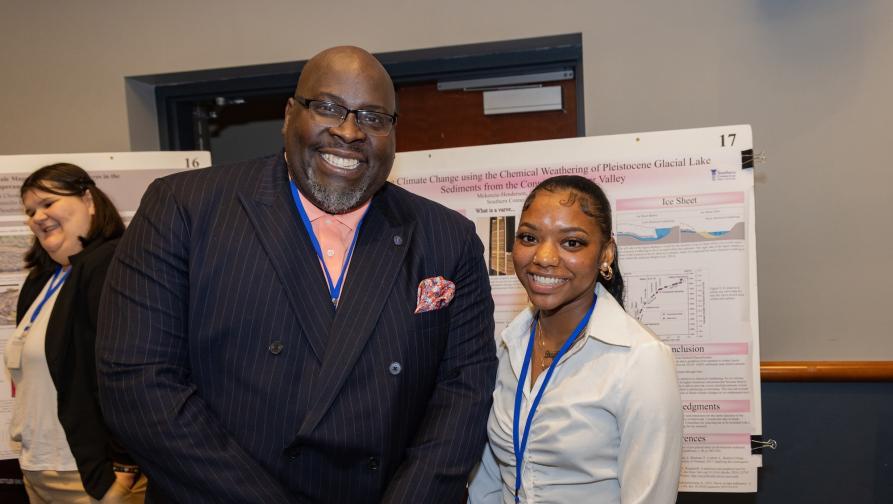 Interim President Dwayne Smith with Student at Earth Science Student Research Event