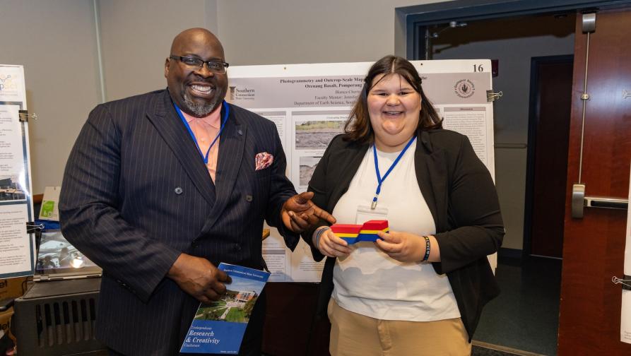 Interim President Dwayne Smith with Student at Earth Science Student Research Event