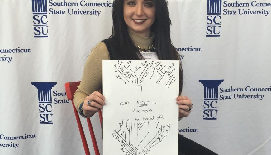 Image of a woman showing a drawing of switch tree, with the words she is not a switch