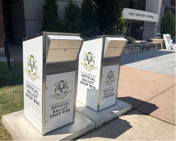 "Ballot boxes with the State of Connecticut emblem"