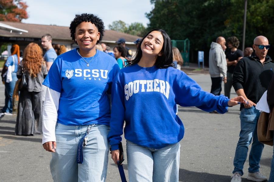 Two students hanging out at homecoming