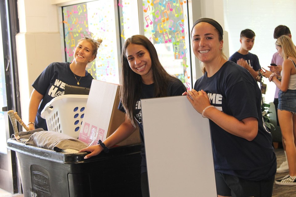 A small group of Southern RA's helping students move in to their dorms