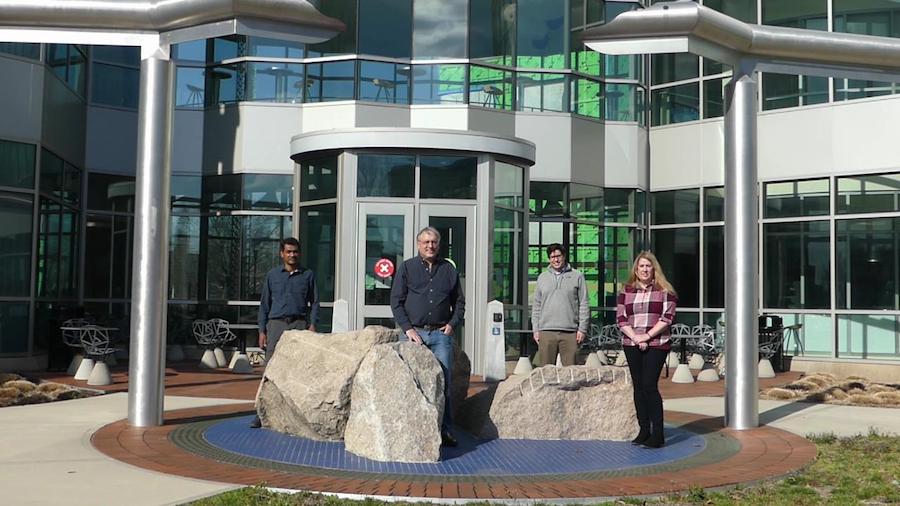A row of SCSU's Earth Science department faculty in from of the Sciences building