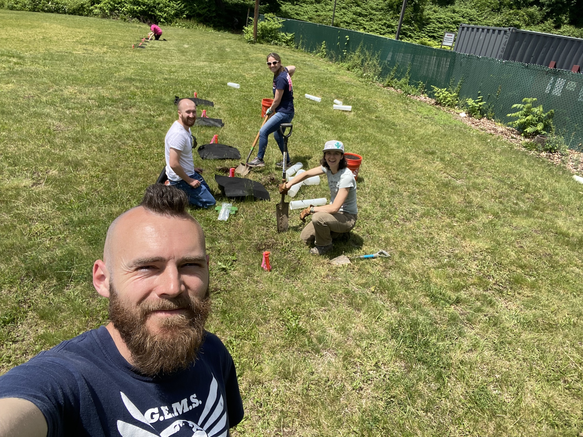 Faculty and Staff planting Chestnut plants in the SCSU Community Garden. 