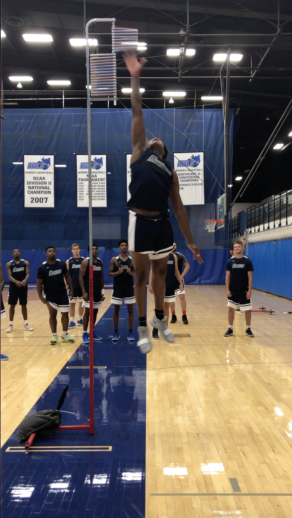 An athlete performing a vertical jump test